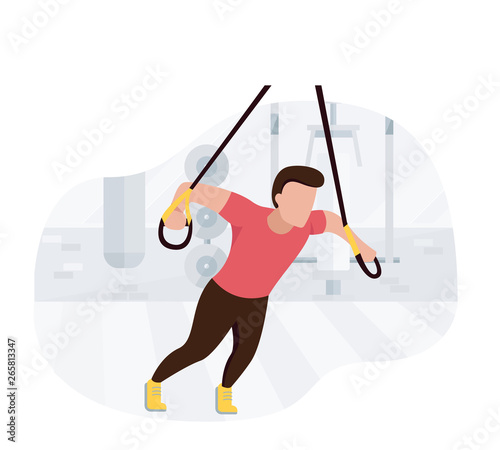 Fit man working out on trx doing bodyweight exercises. Fitness strength training workout.