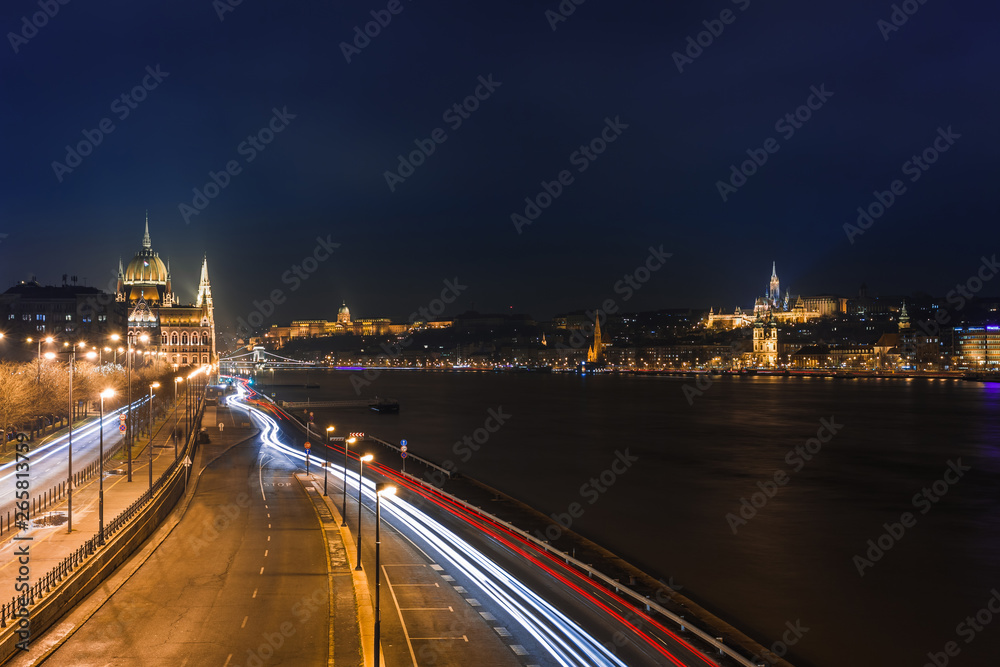 Night view of Budapest. Panorama cityscape of famous tourist destination with Danube, parliament and bridges. Travel illuminated landscape in Hungary, Europe.