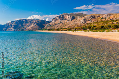 Fototapeta Naklejka Na Ścianę i Meble -  Panoramic sea beach landscape near Gaeta, Lazio, Italy. Nice sand beach and clear blue water. Famous tourist destination in Riviera de Ulisse. Bright sunny light and sunset.