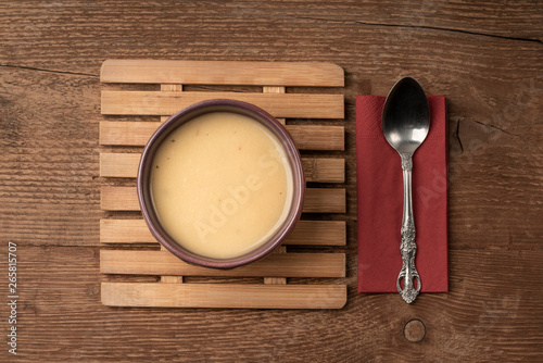 a bowl of soup on wooden table
