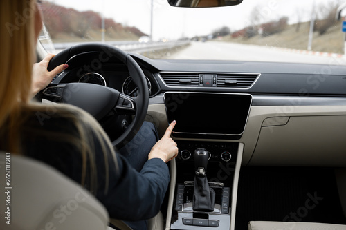 Close up of woman driving and using navigation