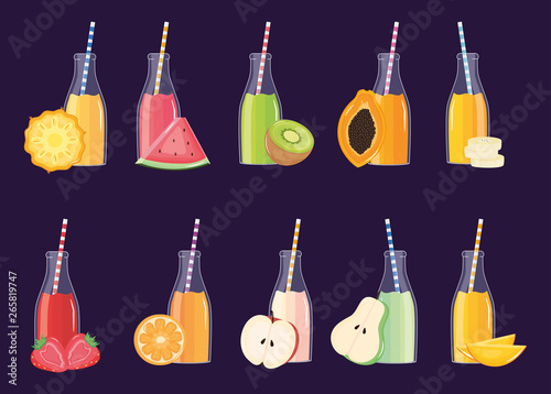 fresh and tropical juices fruits in botttles with straws