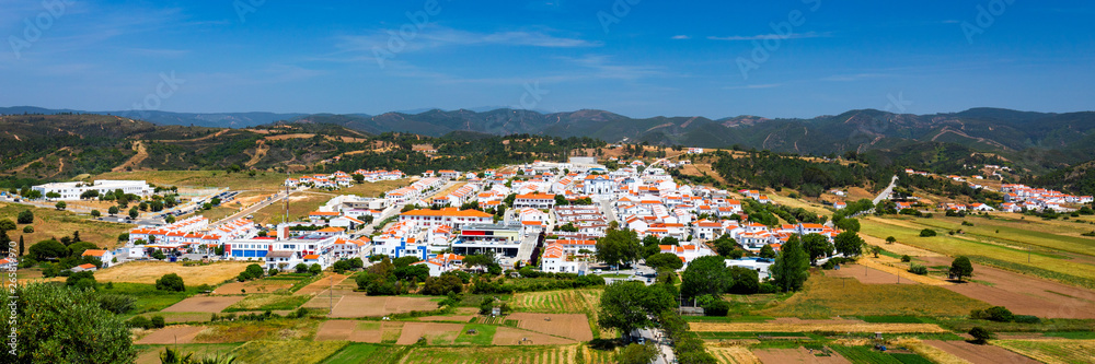 Charming architecture of hilly Aljezur, Algarve, Portugal. View to the small town of Aljezur with traditional portuguese houses and rural landscape, Algarve, Portugal.