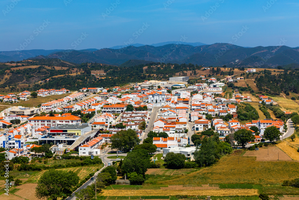 Charming architecture of hilly Aljezur, Algarve, Portugal. View to the small town of Aljezur with traditional portuguese houses and rural landscape, Algarve, Portugal.