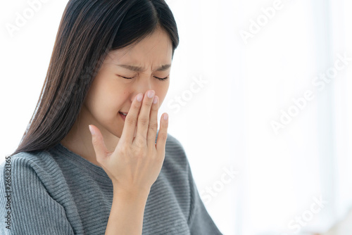 asian unhealthy woman feel cool with flu and cough all the time