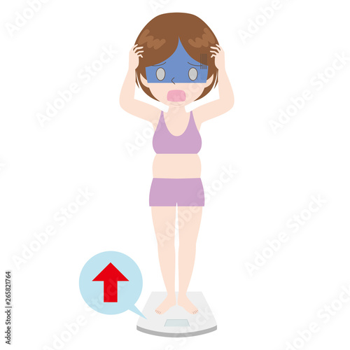 体重計の上で青ざめる女性