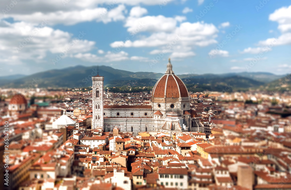 Focus on historical city roofs and famous 14th century Duomo in sunny center of Florence, Italy. UNESCO World Heritage Site