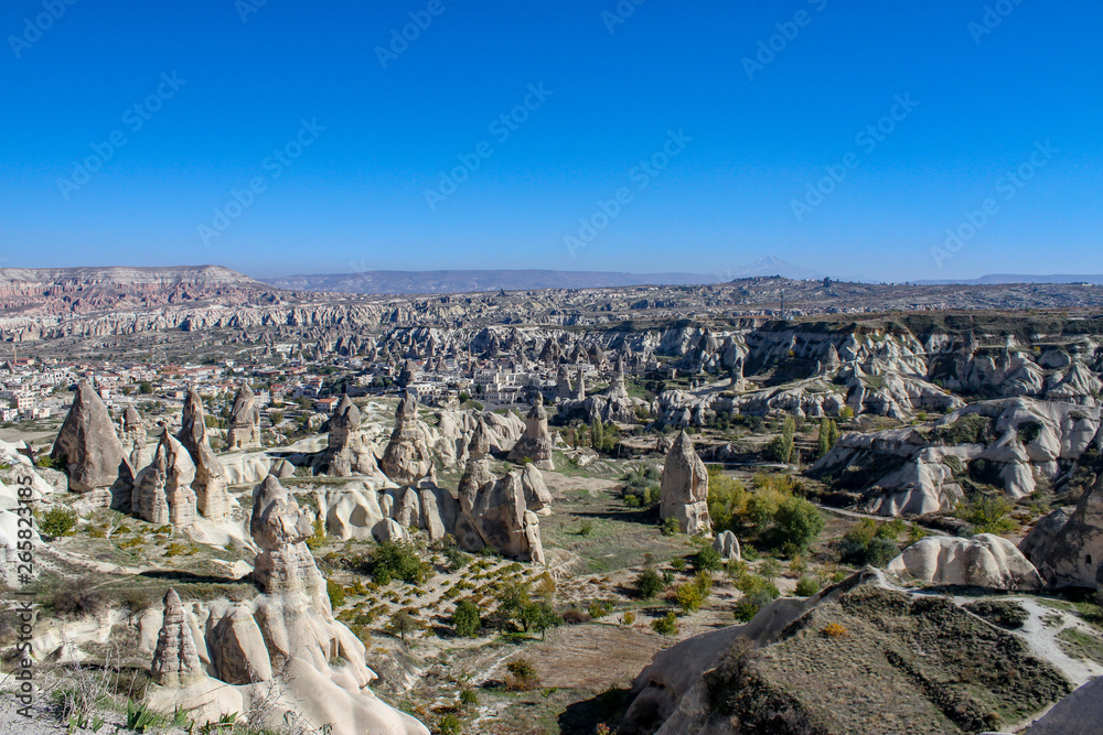 Capadocia Valley with stone chimneys and blue sky in Turkey