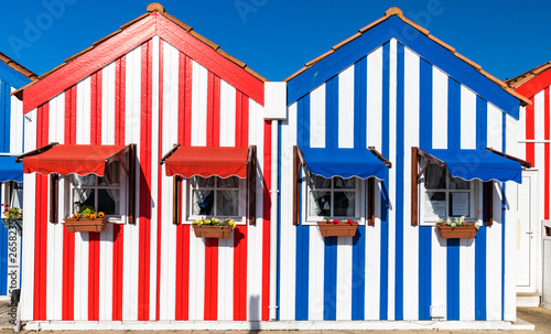 Street with colorful houses in Costa Nova, Aveiro, Portugal. Street with striped houses, Costa Nova, Aveiro, Portugal. Facades of colorful houses in Costa Nova, Aveiro, Portugal.