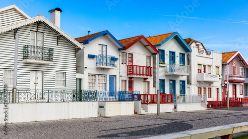 Street with colorful houses in Costa Nova, Aveiro, Portugal. Street with striped houses, Costa Nova, Aveiro, Portugal. Facades of colorful houses in Costa Nova, Aveiro, Portugal.