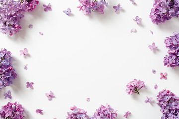 Decorative frame of beautiful purple lilac flowers.
