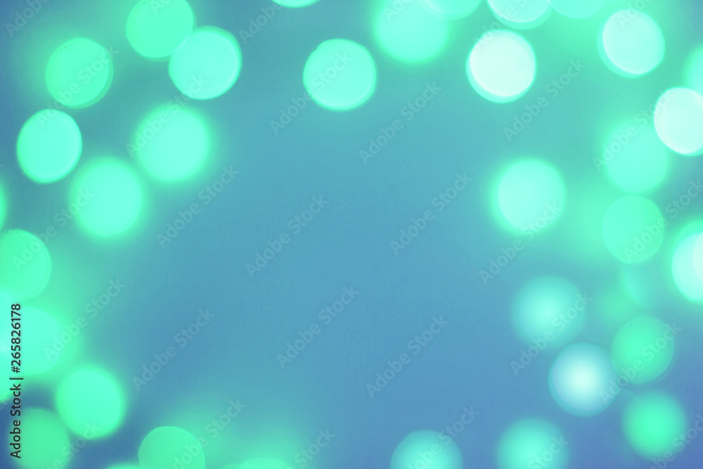 Blurred green and blue sparkling festive bokeh background Blurred green and blue sparkling festive bokeh background