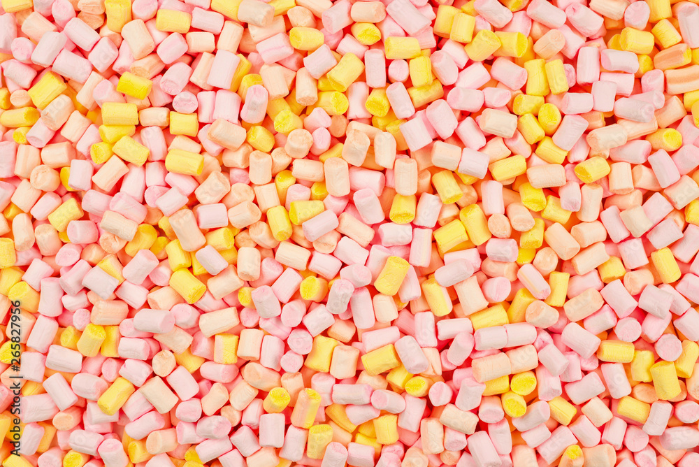 Marshmallow. Background of pink and yellow colorful mini marshmallows.