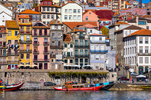 Ancient city of Porto with old multi-colored houses with red roof tiles. Portugal, Porto