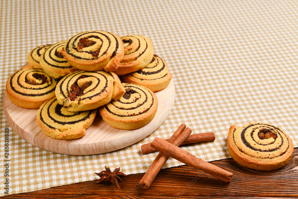 Fototapeta premium Home made baked cookies with raisins and poppy seeds. Space for text or design.