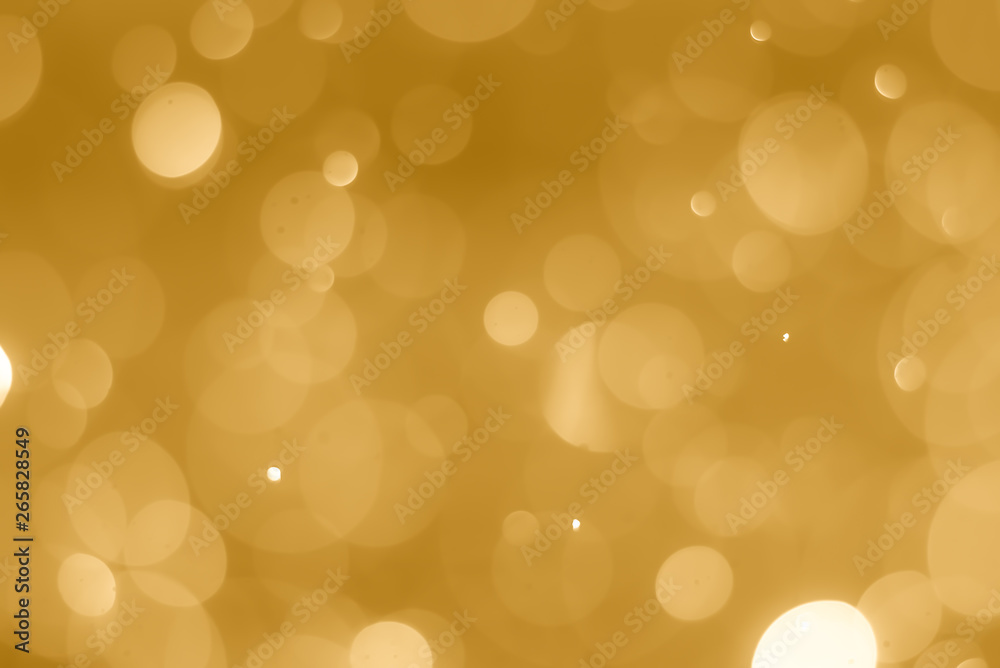 Fototapeta premium abstract soft bokeh light effect with golden background