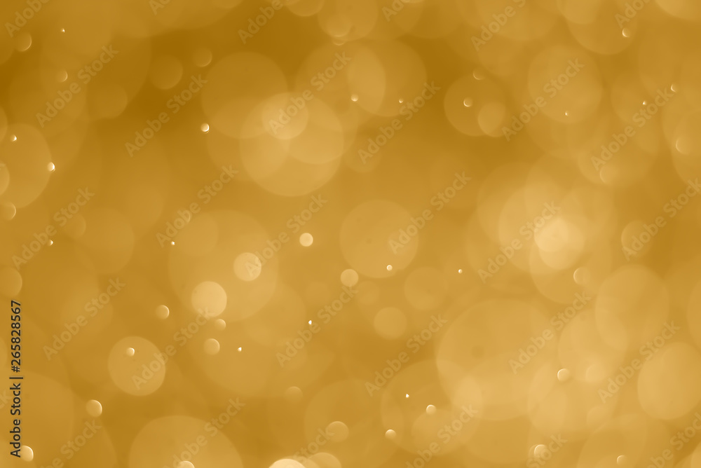 abstract soft bokeh light effect with golden background abstract soft bokeh light effect with golden background