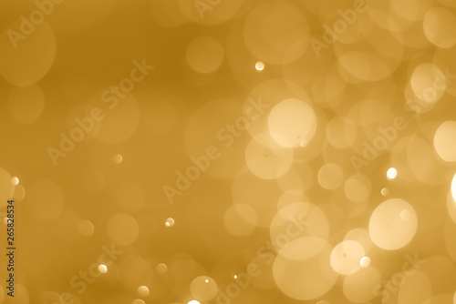 abstract soft bokeh light effect with golden background