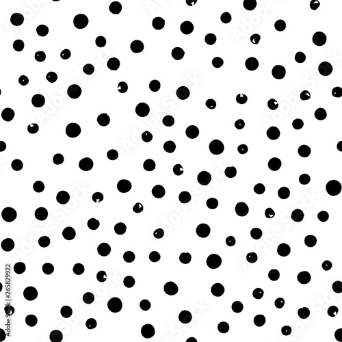 Seamless hand drawn Doodle polka dots brush black and white pattern