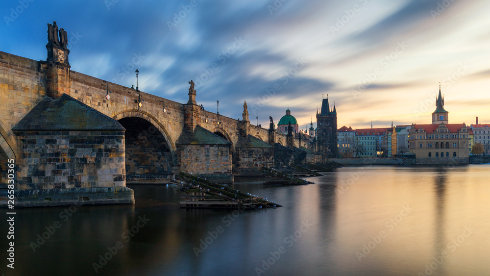 Morning view of Charles Bridge in Prague, Czech Republic. The Charles Bridge is one of the most visited sights in Prague. Architecture and landmark of Prague. Long exposure photo.