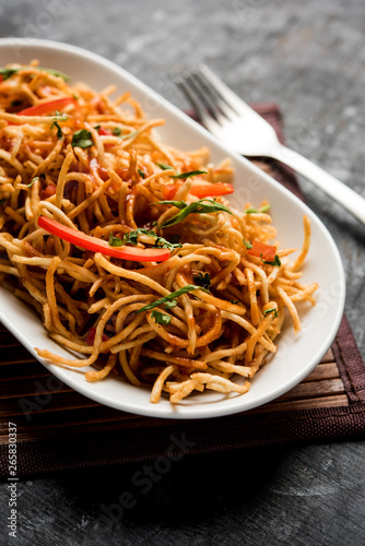 Chinese Bhel is a spicy indo-chinese recipe  served in a bowl. selective focus