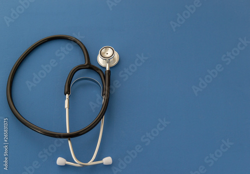 Stethoscope on blue background. Copy spaсe . The concept of medicine.