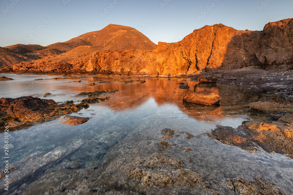 Sunrise on the coast of Escullos. Natural Park of Cabo de Gata. Spain.