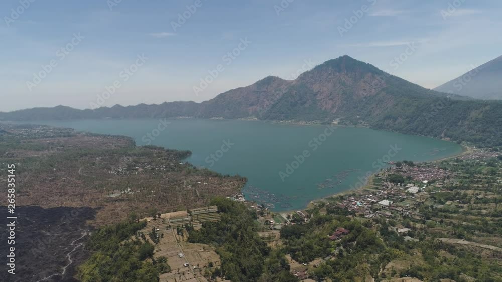 Aerial view crater lake and volcano Batur mountain landscape with volcanoes, lake with sky and clouds Bali, Indonesia. Travel concept. Aerial footage. Aerial view crater lake and volcano Batur mountain landscape with volcanoes, lake with sky and clouds Bali, Indonesia. Travel concept. Aerial footage.