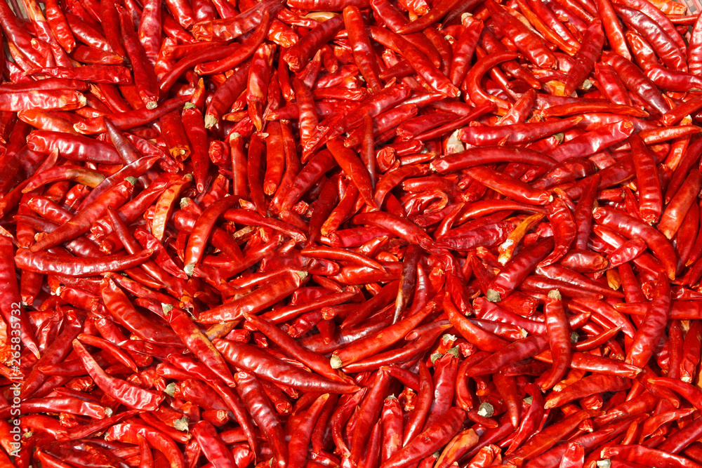 Fototapeta premium Hot sharp burning pods of ripe juicy red chili peppers. Natural ecological background.
