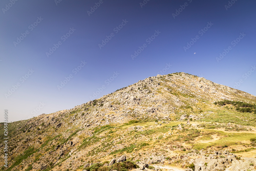 Panoramic of some beautiful green mountains with paths and stones Panoramic of some beautiful green mountains with paths and stones