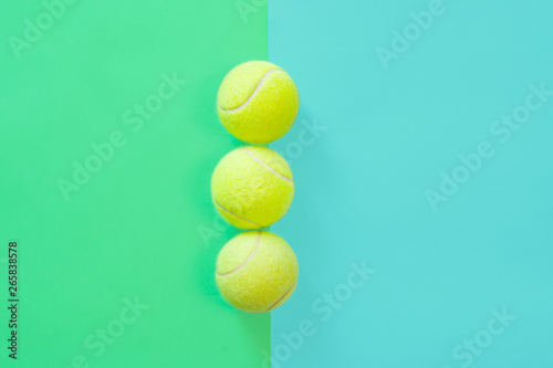 Big tennis ball on blue background. minimal design top view © allasimacheva