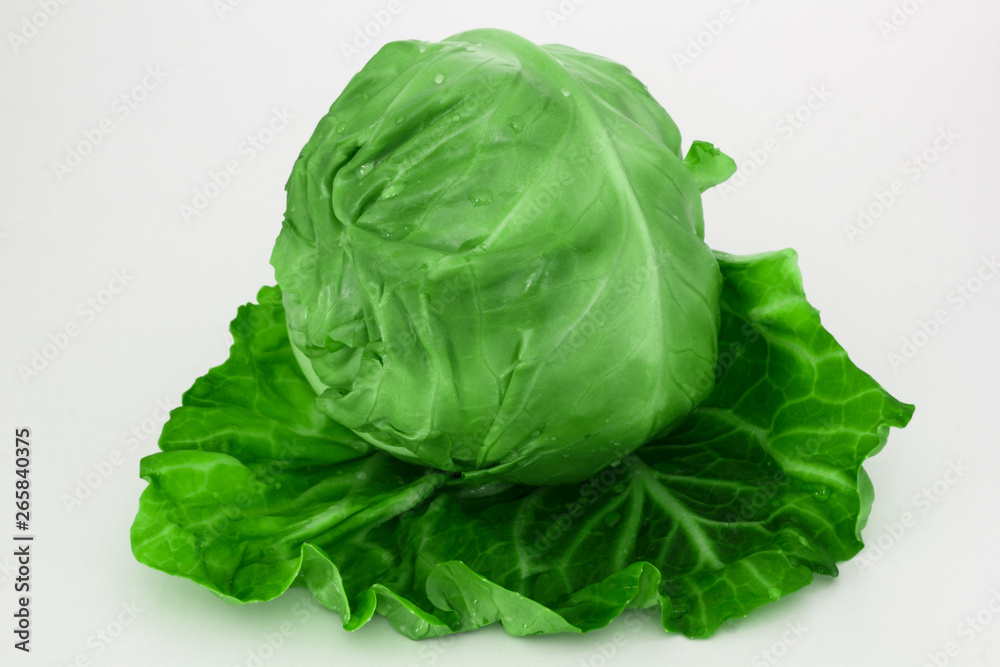 Fresh green cabbage organic vegetable close up on a white background Fresh green cabbage organic vegetable close up on a white background