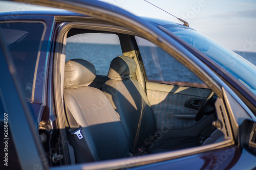 Blue car at sunset