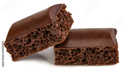 porous chocolate pieces isolated on white background photo