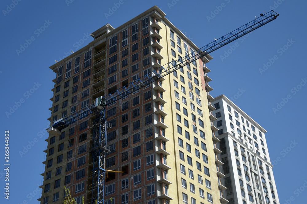 Constructing high rise building with crane