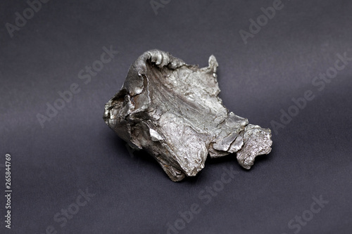 Tektite Meteorite Sikhote Alin isolated on gray background photo