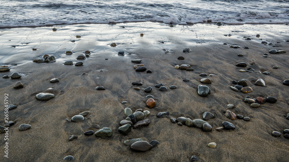 Small stones on the black beach Small stones on the black beach