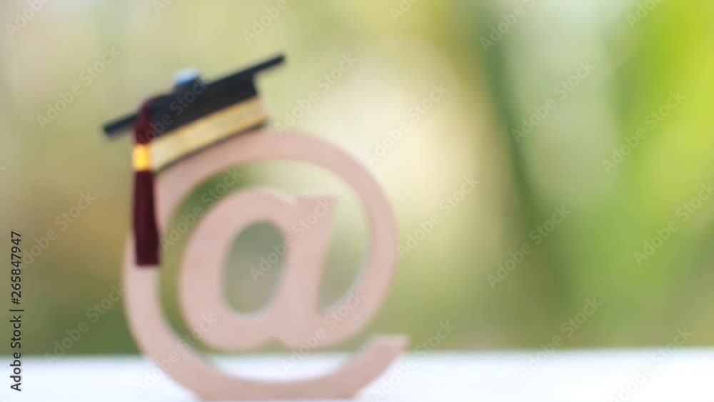 Education University of online training courses or distance learning in abroad international study concept: Graduation cap on email address symbol.Communication school can learn by internet technology