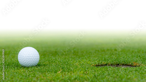 A golf ball at the hole