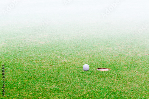 golf ball hole on a field