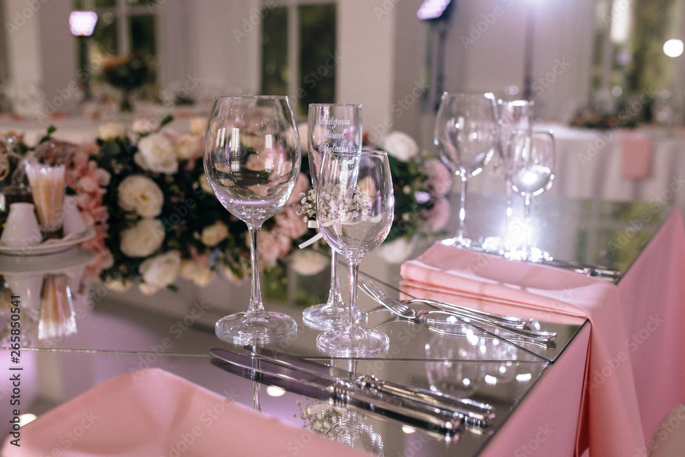 Restaurant table with glasses, napkins and cutlery