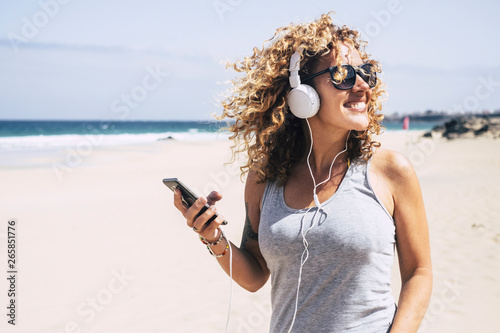 Canvas Print Cheerful beautiful young people blonde woman curly hair enjoying the summer holi