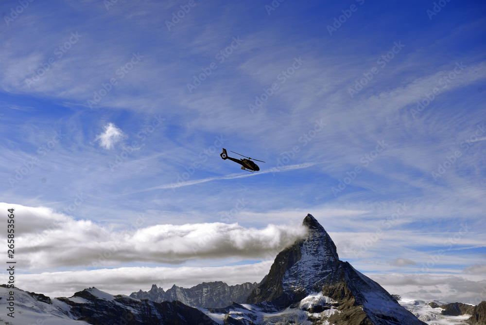escue helicopter over the Matterhorn mountain escue helicopter over the Matterhorn mountain