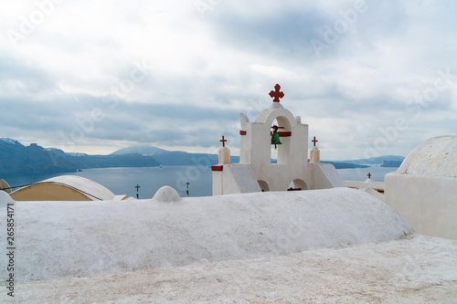 Whitewashed Bell Tower in Oia, Santorini, Greece photo