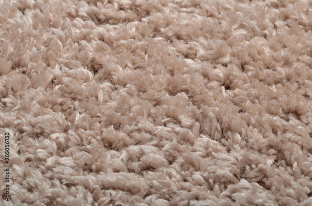 Texture of modern beige shaggy carpet - background Texture of modern beige shaggy carpet - background