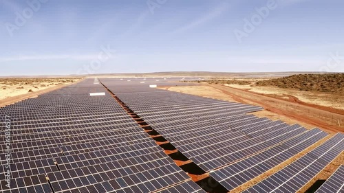 Aerial shot of rows and rows of photovoltaic panels at sloar energy plant. photo