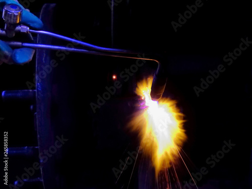 Welding parts, worker heats the detail of a gas torch