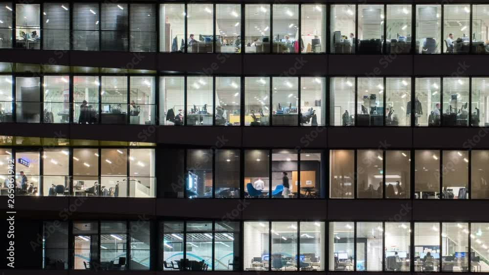People work in the office building in the financial city center.