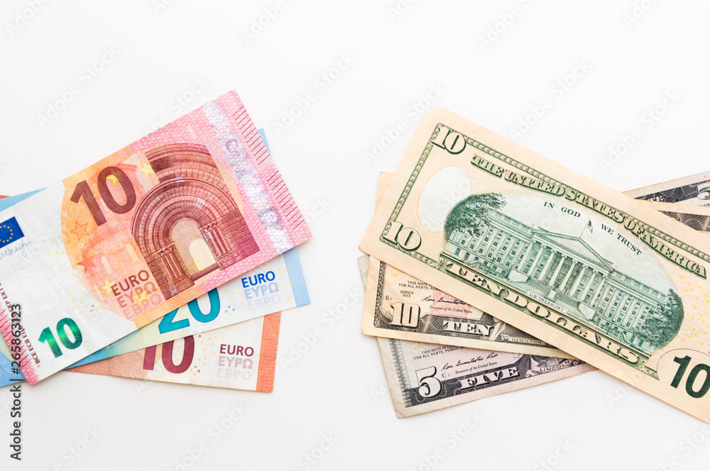 American Dollar and Euro Banknotes isolated on white background.