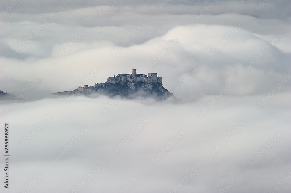Unique Spis (Spiš, Spišský) castle in the mist. Second biggest castle in Middle Europe, Unesco Wold Heritage, Slovakia